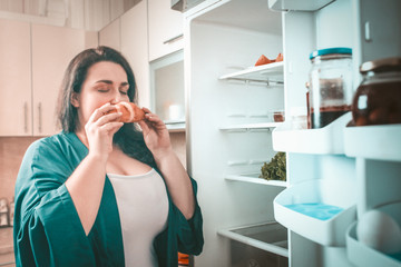 Body Positive Woman Sniffs Croissant Closing Her Eyes In Pleasure