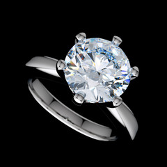 Diamond engagement ring isolated on black background