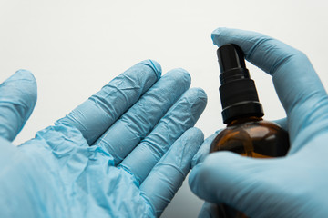 sterilization of hands with protective blue gloves. .basic defenses during the COVID-19 pandemic
