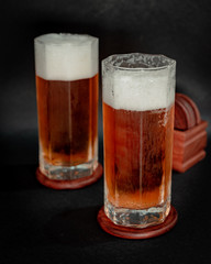 glass of beer on dark background