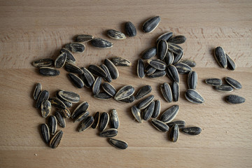 Mottled Sunflower Seeds on wooden table