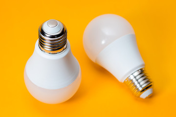 LED, New technology light bulb on yellow background, Energy super saving electric lamp is good for environment