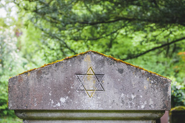 Star of David on an old headstone in an ancient jewish cemetery