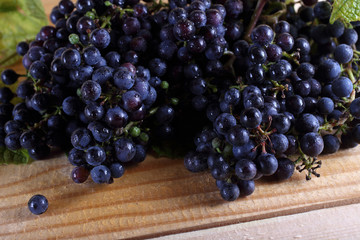 Black wine grape on table