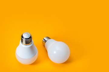 LED, New technology light bulb on yellow background, Energy super saving electric lamp is good for...