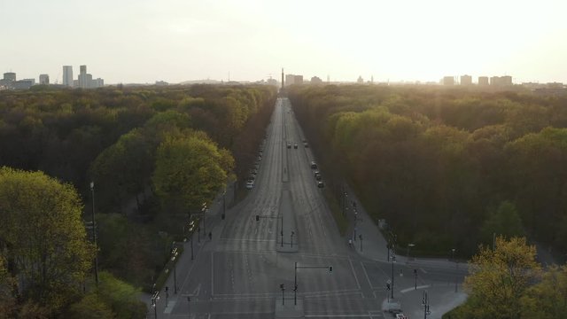 AERIAL: Strasse des 17. Juni in Berlin, Germany towards Victory Column Empty because of Corona Virus COVID19 Pandemic in Beautiful Sunset Light