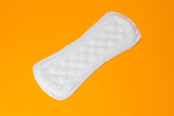 Daily female gasket on yellow background. copy space.