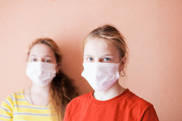  young girls in   medical masks