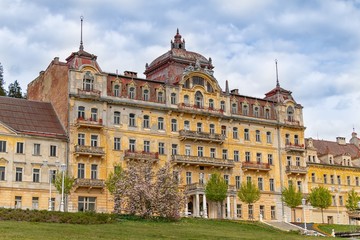 Fototapeta na wymiar House Kavkaz - ruin of spa hotel on Goethe square in Marianske Lazne (Marienbad) - Czech Republic