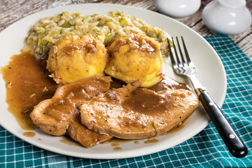 Stewed turkey meat in gravy.
