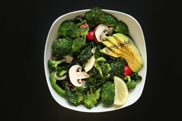 Green Salad . Raw ingredients - Kale, lemon, apple, radish, mushroom, broccoli, avocado, pepper, celery, parsley, chia seeds. Vegetarian lunch. Healthy food. 