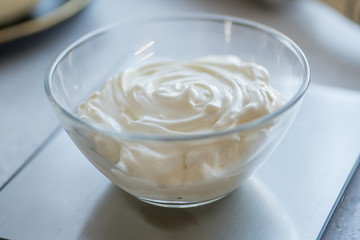 Step-by-step instructions for making bagel cookies. capacity with sour cream on the scales, step1