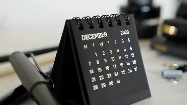 Small black calendar standing on the office desk. December month 2020 Year.
