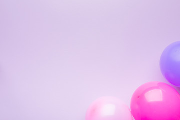 Balls purple and pink on pink paper background. Holiday background. Copy space.