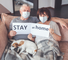 Elderly couple in medical masks during the pandemic coronavirus