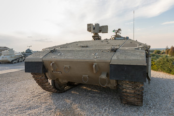 Israeli infantry fighting vehicle in the setting sun is on the Memorial Site near the Armored Corps Museum in Latrun, Israel