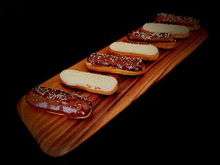 French eclair with white and black chocolate topping