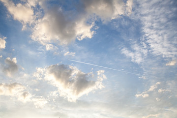 Cloudy sky and airplane track