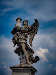 Angel statue with beautiful blue sky in Italy , Rome