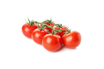Branch of fresh tomatoes isolated on white background
