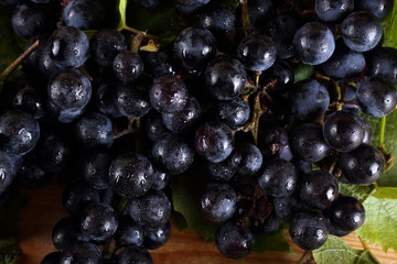 Black wine grape on table