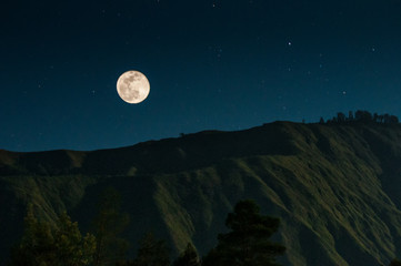 Naklejka na ściany i meble full moon over the mountains