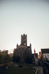Fototapeta premium GHENT, BELGIUM - August, 2019: Medieval city of Gent (Ghent) in Flanders with Saint Nicholas Church and Gent Town Hall, Belgium. Sunset cityscape of Gent. Before Corna Crisis