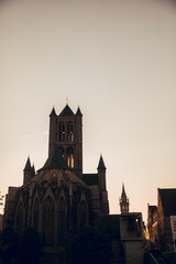 GHENT, BELGIUM - August, 2019: Medieval city of Gent (Ghent) in Flanders with Saint Nicholas Church and Gent Town Hall, Belgium. Sunset cityscape of Gent. Before Corna Crisis