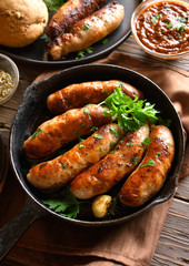 Fried sausages in frying pan