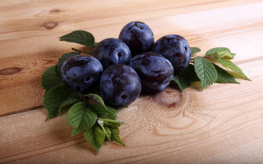 Plums on table