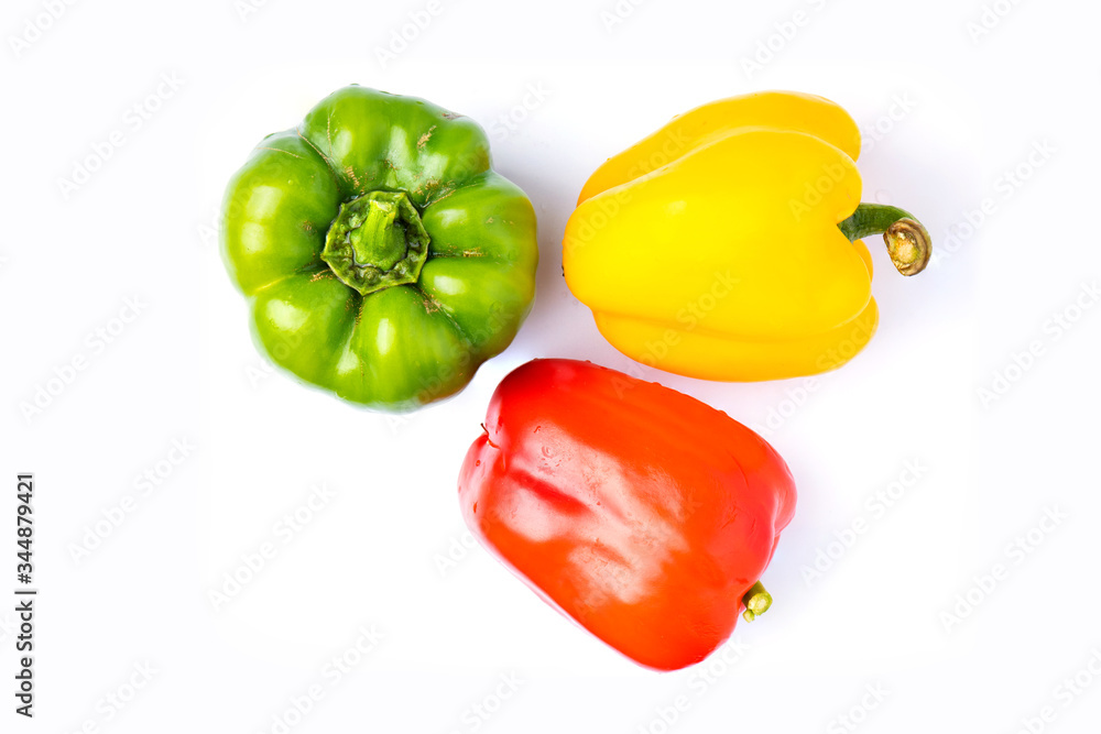 Wall mural top view colorful vegetable, yellow, green and red, bell pepper isolated on white background