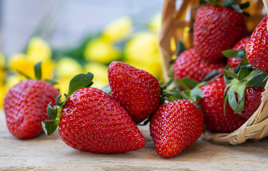 Strawberries in a wooden bowl. Fresh  strawberries on a wooden table. Strawberry juice. strawberries on a natural background.
