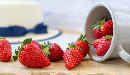 Strawberries in an iron mask. Fresh strawberries on a wooden table. Strawberry juice. strawberries on a natural background.