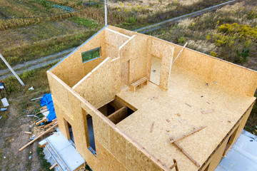 Construction of new and modern modular house. Walls made from composite wooden sip panels with...