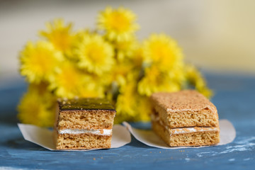 pieces of cake on the background of yellow flowers
