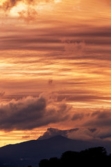 
sunset over the sea. clouds, mountains mountains 
