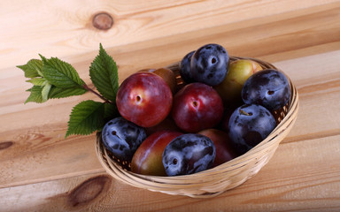 Plums on table