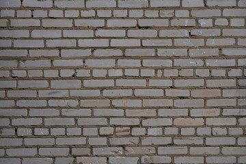  old white brick wall of the house