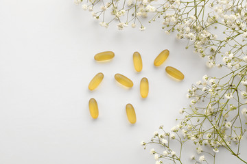 Cod liver oil omega 3 gel capsules isolated on white background. Fish oil gel capsules with a...
