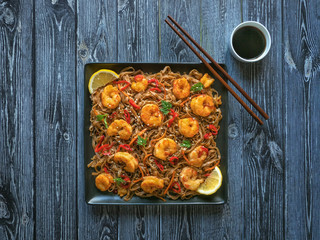 Asian udon noodles with fried shrimps