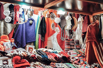 Stall with colorful woolen clothes Riga Christmas market