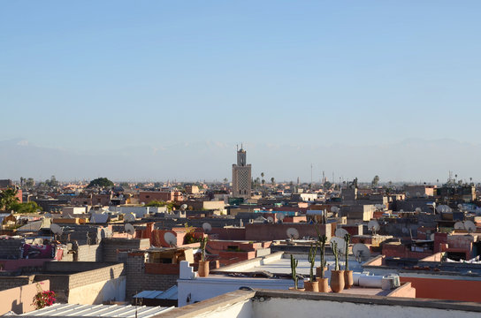 View of marrakech old town from balcony. Marrakesh, a former imperial city in western Morocco, is a major economic center and home to mosques, palaces and gardens. 