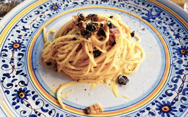 Italian traditional pasta with truffles mushrooms in plate at restaurant