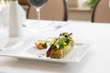 Fresh salmon tartare served with salad