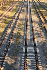 Fototapeta premium Rusty railroad tracks on gravel. Top view.