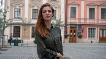 Fototapeta premium Outdoor close up portrait of young beautiful fashionable woman