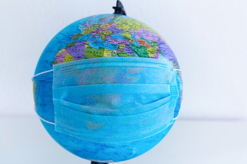 Planet Earth with a protective mask. World medical concept. coronavirus