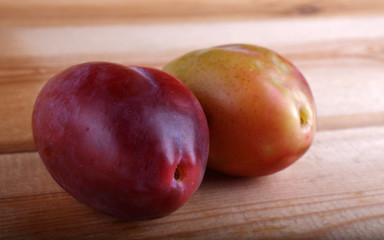 Plums on table