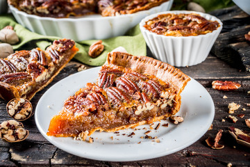 Homemade autumn pecan pie on wooden rustic background, Traditional fall and winter, thanksgiving american nut cake,