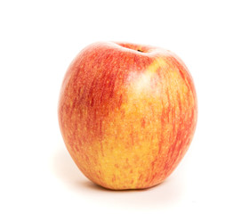 A Fuji organic apple on a white background.